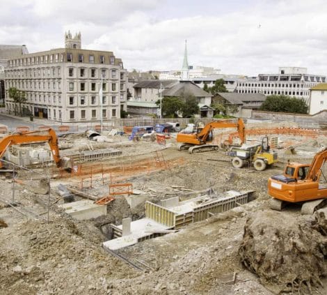Excavators carrying out ground investigation and site preparation on a city centre construction project