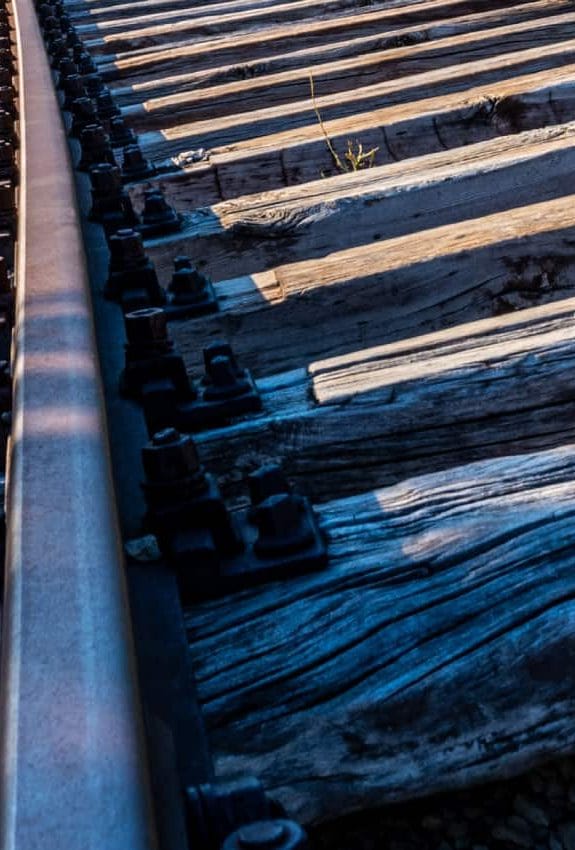Railway track on a steep embankment showing timber sleepers and ballast